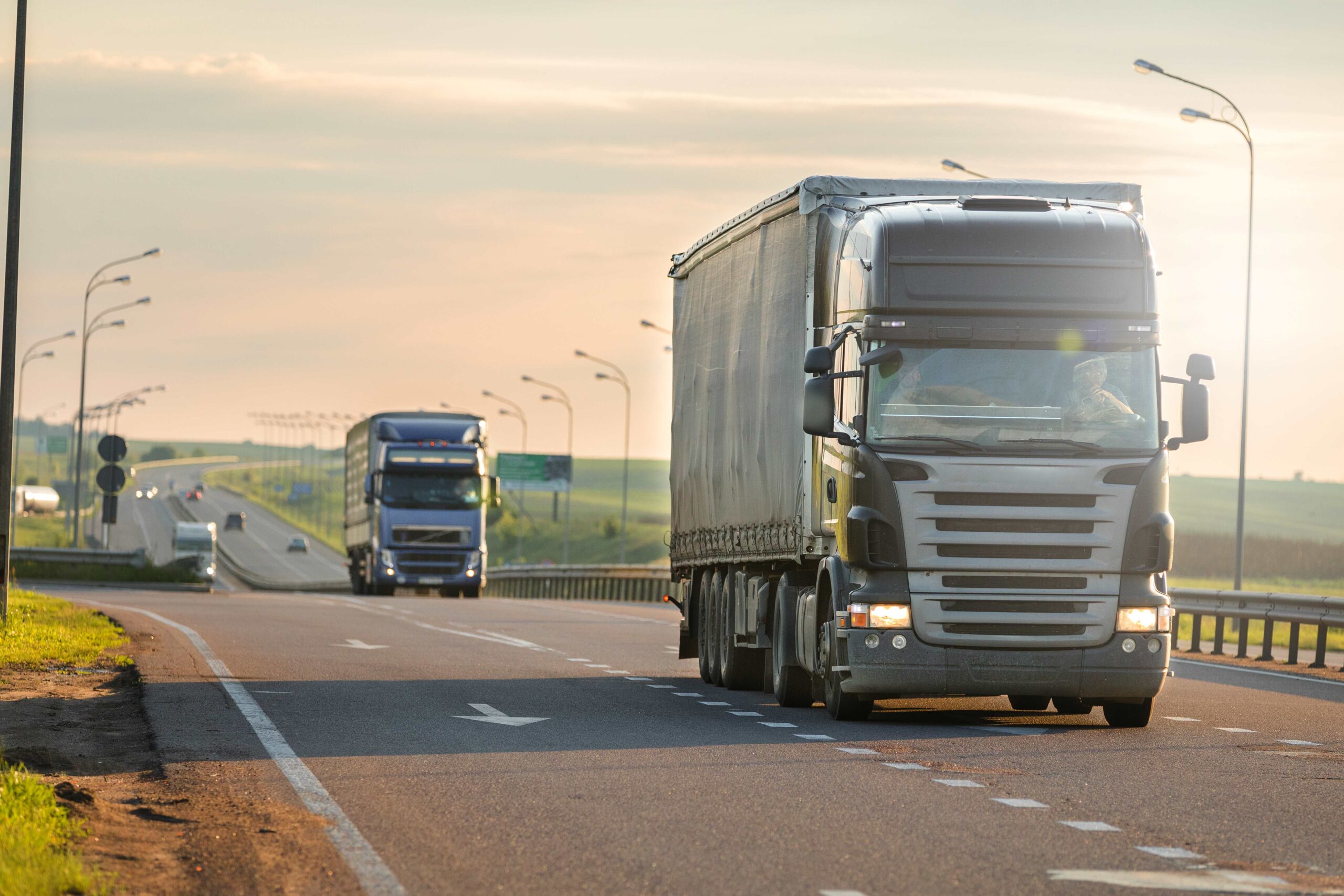 arriving-white-truck-road-rural-landscape-sunset
